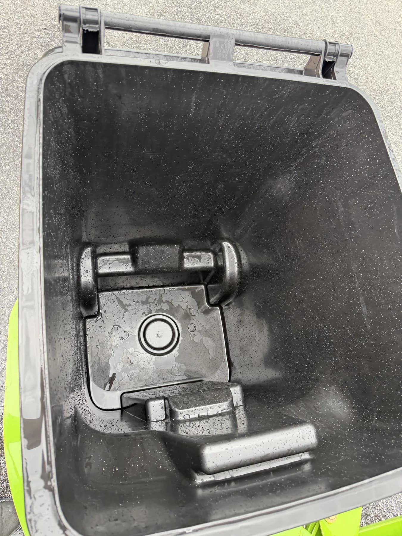 Clean black residential trash bin